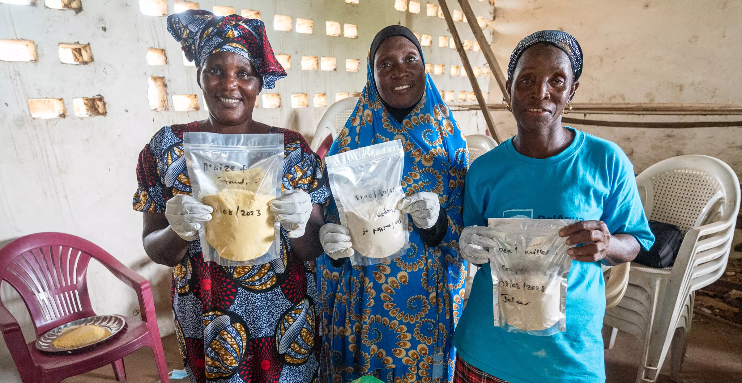 Members of the Jahaur Yanpi Cooperative show packaged mixed flour used to make porridge.